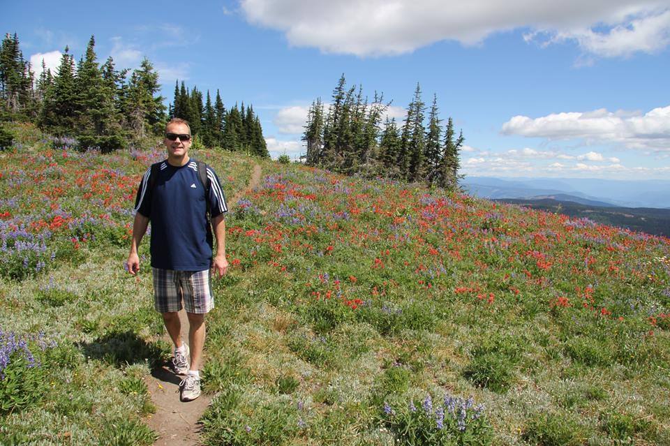 Wildflower blossoms and panoramic view at Sun Peaks Resort with beautiful summer hikes - photo by BestSunPeaks.com