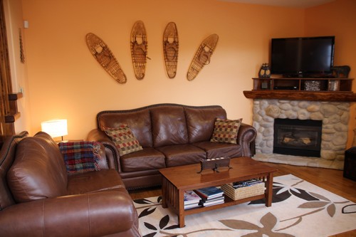 Spacious Trappers Landing Sun Peaks family room with River Rock fireplace at BestSunPeaks.com