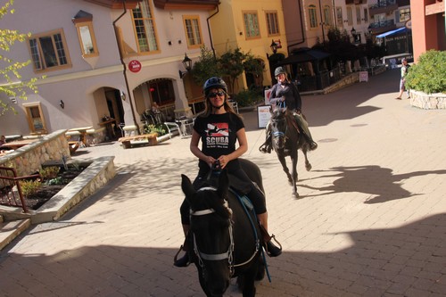 Horse rides through Sun Peaks village